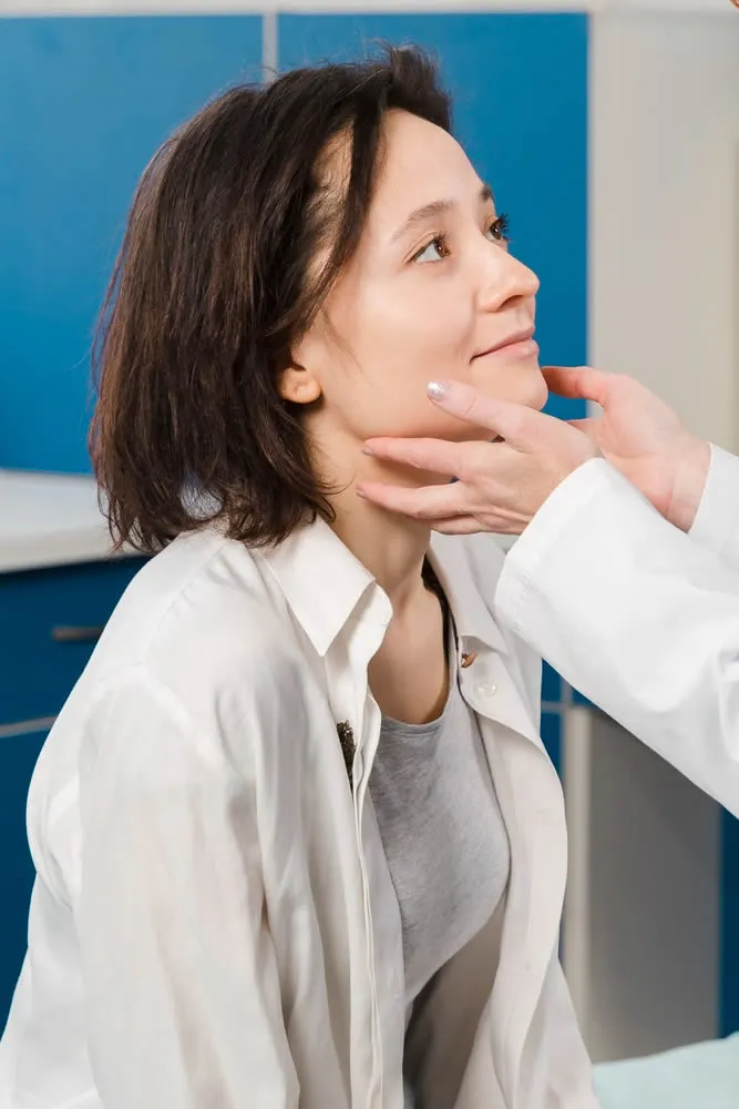 dermatologist-with-patient-with-hands-on-face